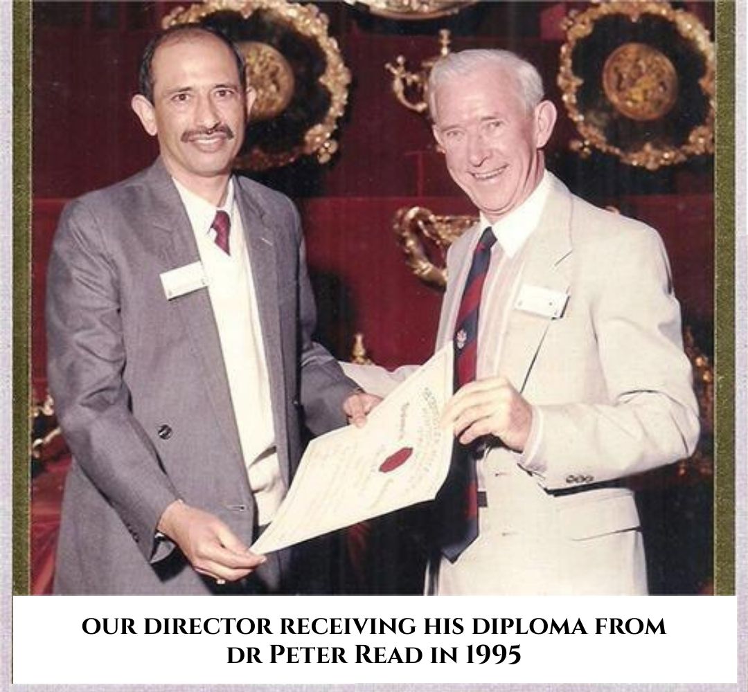 Director receiving diploma certificate from Dr Peter Read during award ceremony in 1995